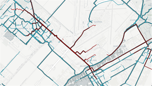 Figure 69 Origin and destination of bicycle traffic based on'fietstelweek' data - Description: An aerial view of a map showing many lines of bicycle traffic in red on top of the map based on data. 