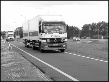 Photo of cars and trucks on highway.